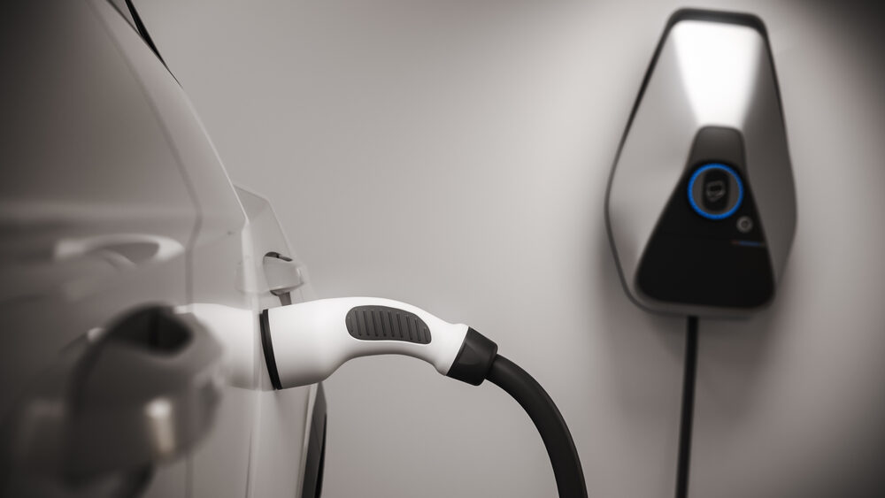 Home EV charger mounted on a garage wall